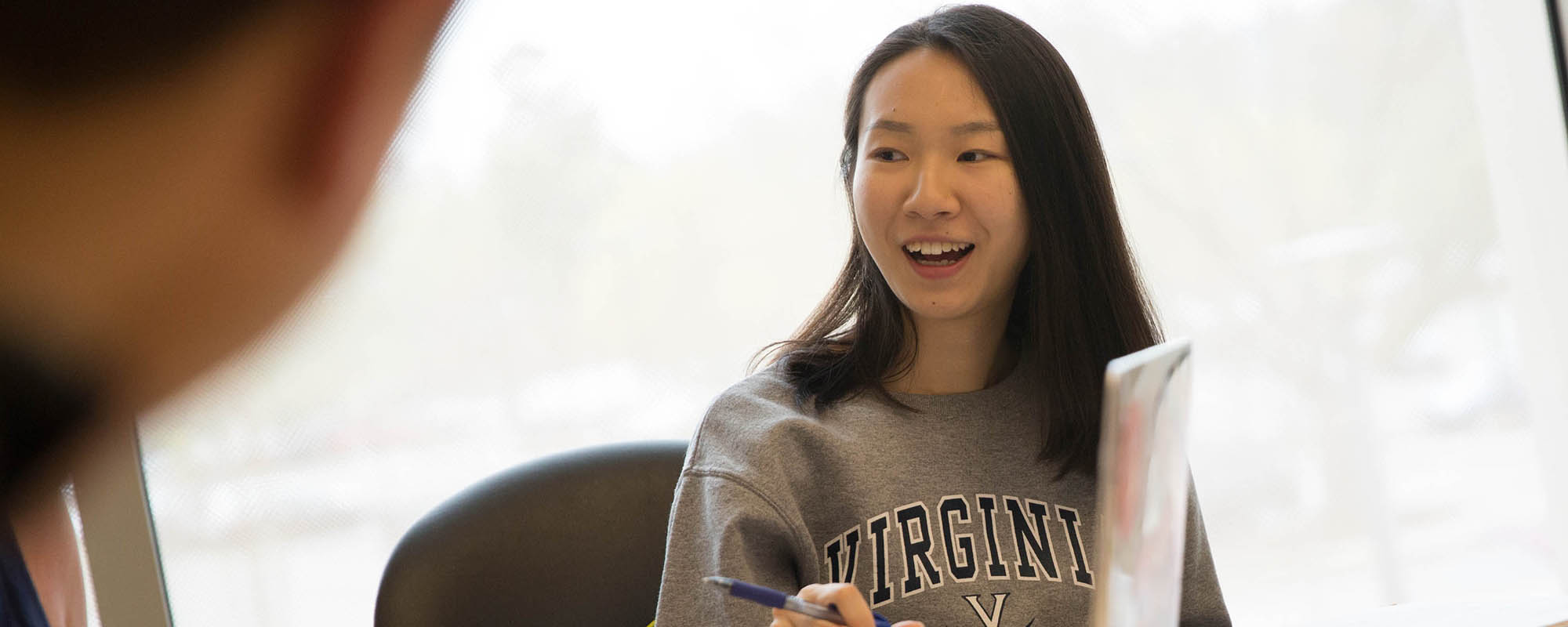 Female student talking to others