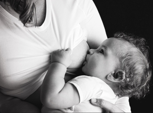 Woman breastfeeding an infant