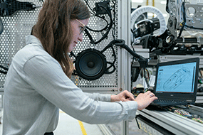 Woman working at laptop in lab